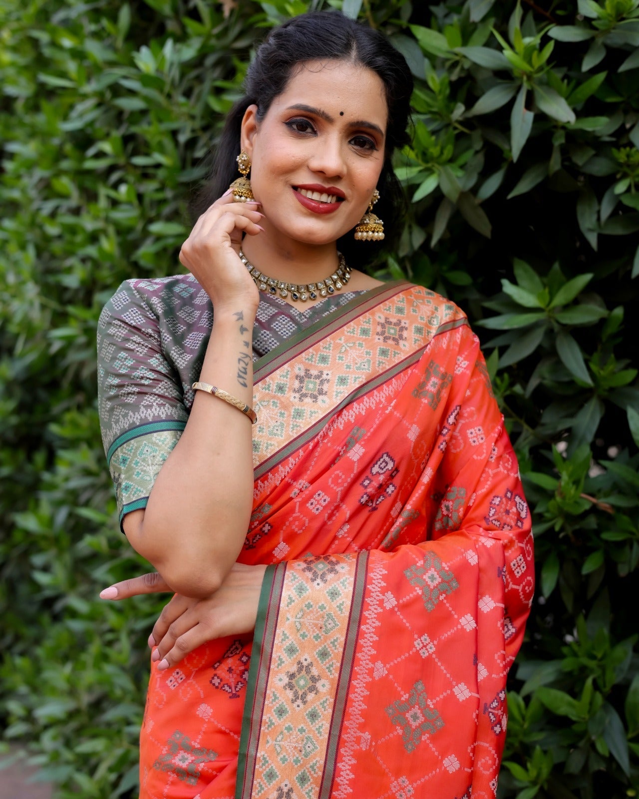 Dazzling Patola Silk Red Color Kanchi Border Saree