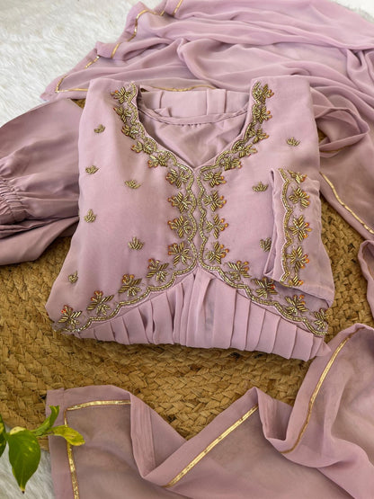 Delightful Dusty Peach Color Georgette With Hand Work Party Wear Gown