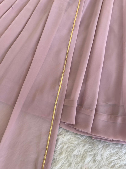 Delightful Dusty Peach Color Georgette With Hand Work Party Wear Gown
