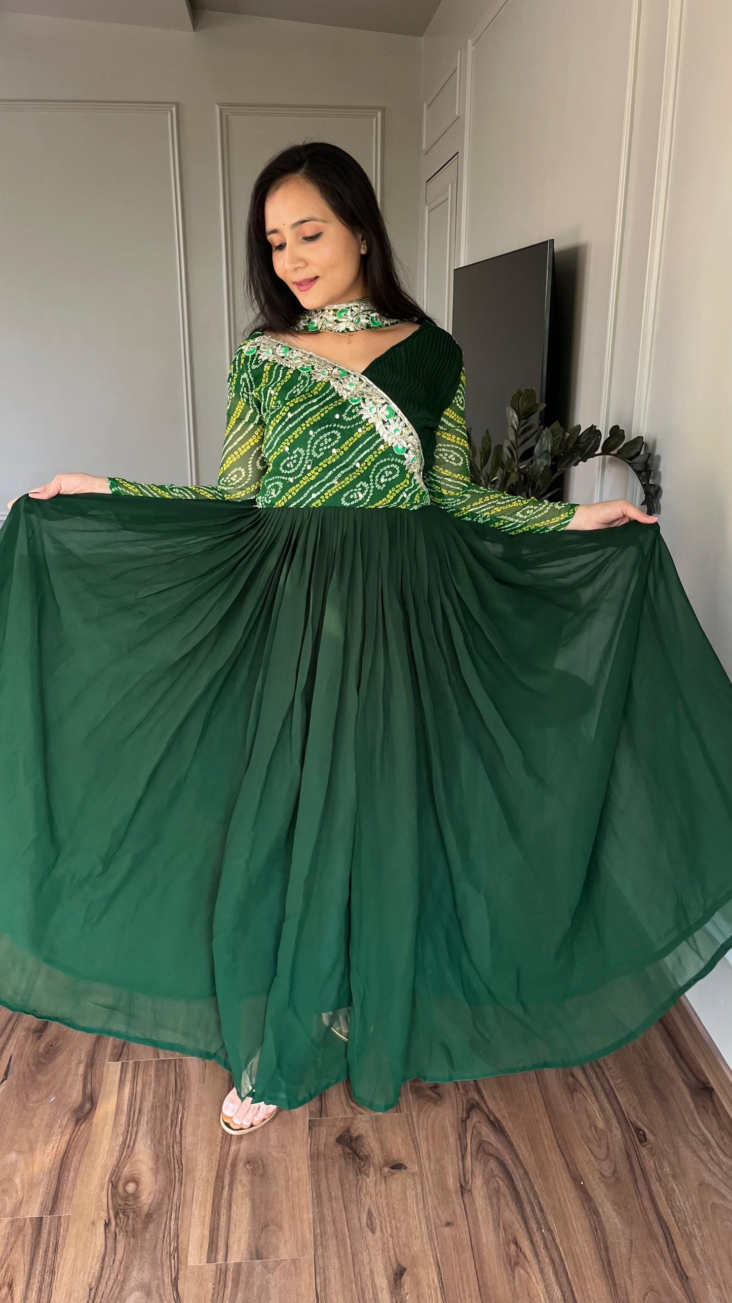 Luxuriant Green Color Pure Bandhej With Faux Georgette And Sequence Embroidery Work Beautiful Gown