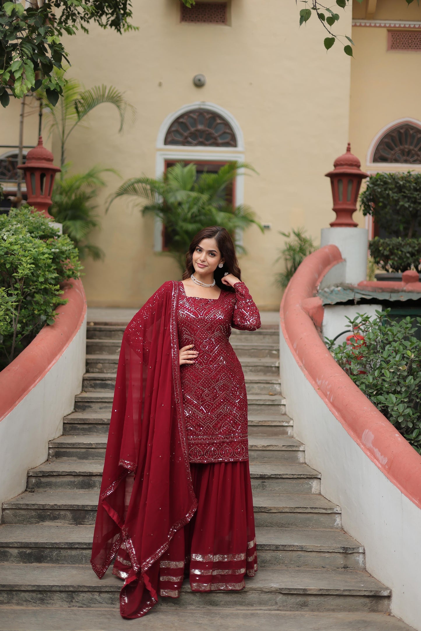 Party Wear Maroon Color Faux Georgette With Sequins And Thread Embroidered Work Beautiful Sharara Suit