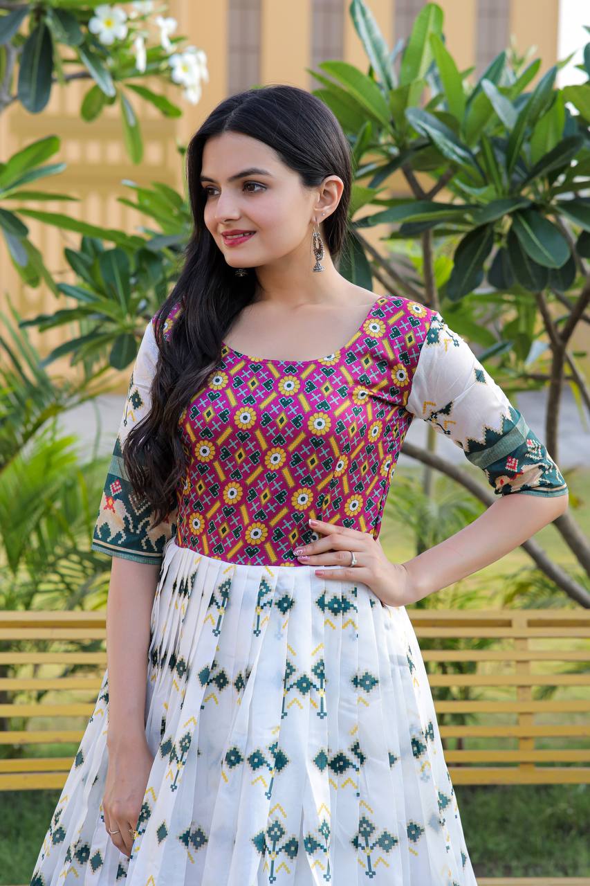 Precious White Color With Green Print Patola Silk Gown