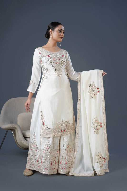 Mesmerizing  Embroidery And Sequence Work White Color Sharara Suit