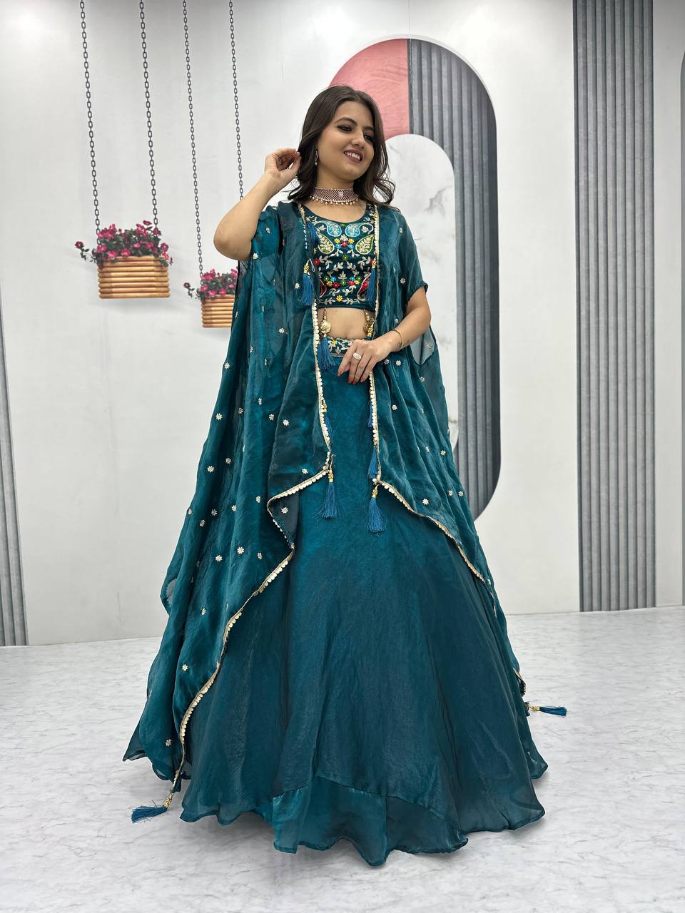 Fancy Embroidery Work Teal Green Color Lehenga Choli With Strug