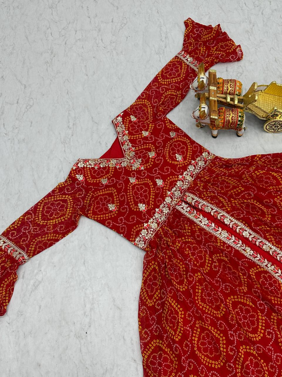 Stunning Bandhrej Orange Color Top With Lehenga
