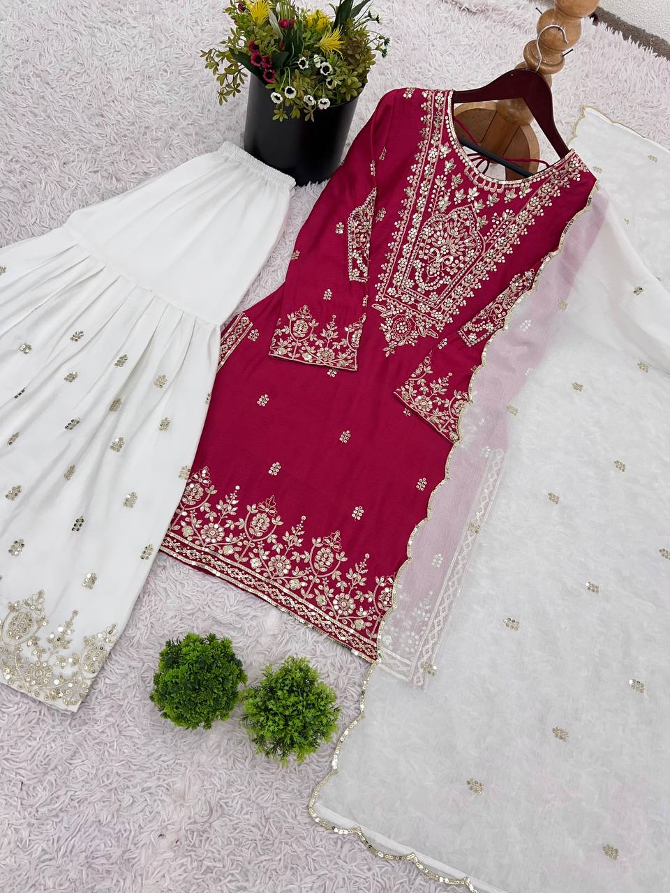 Flattering Embroidery Work Pink Color Sharara Suit